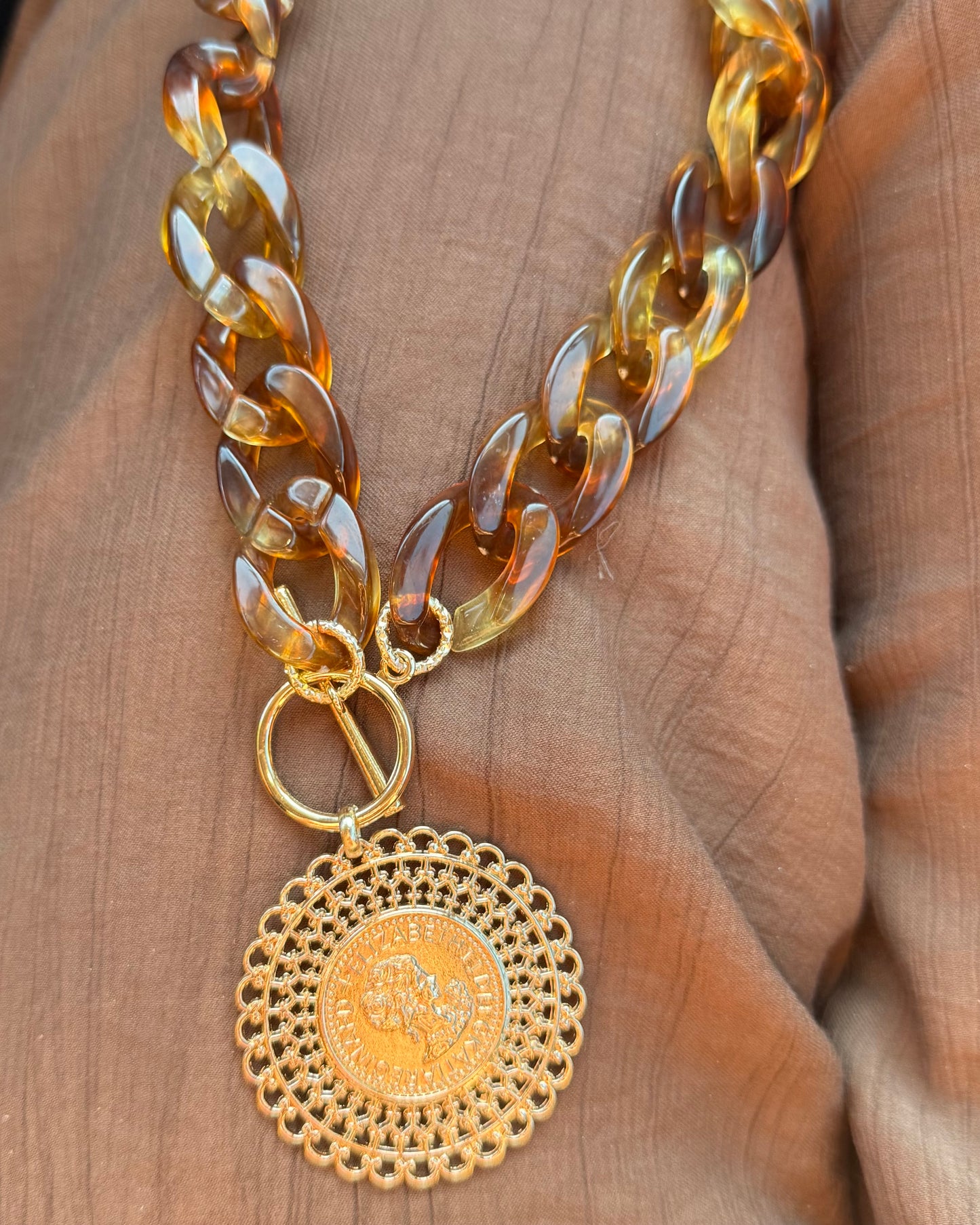 Colgante moneda